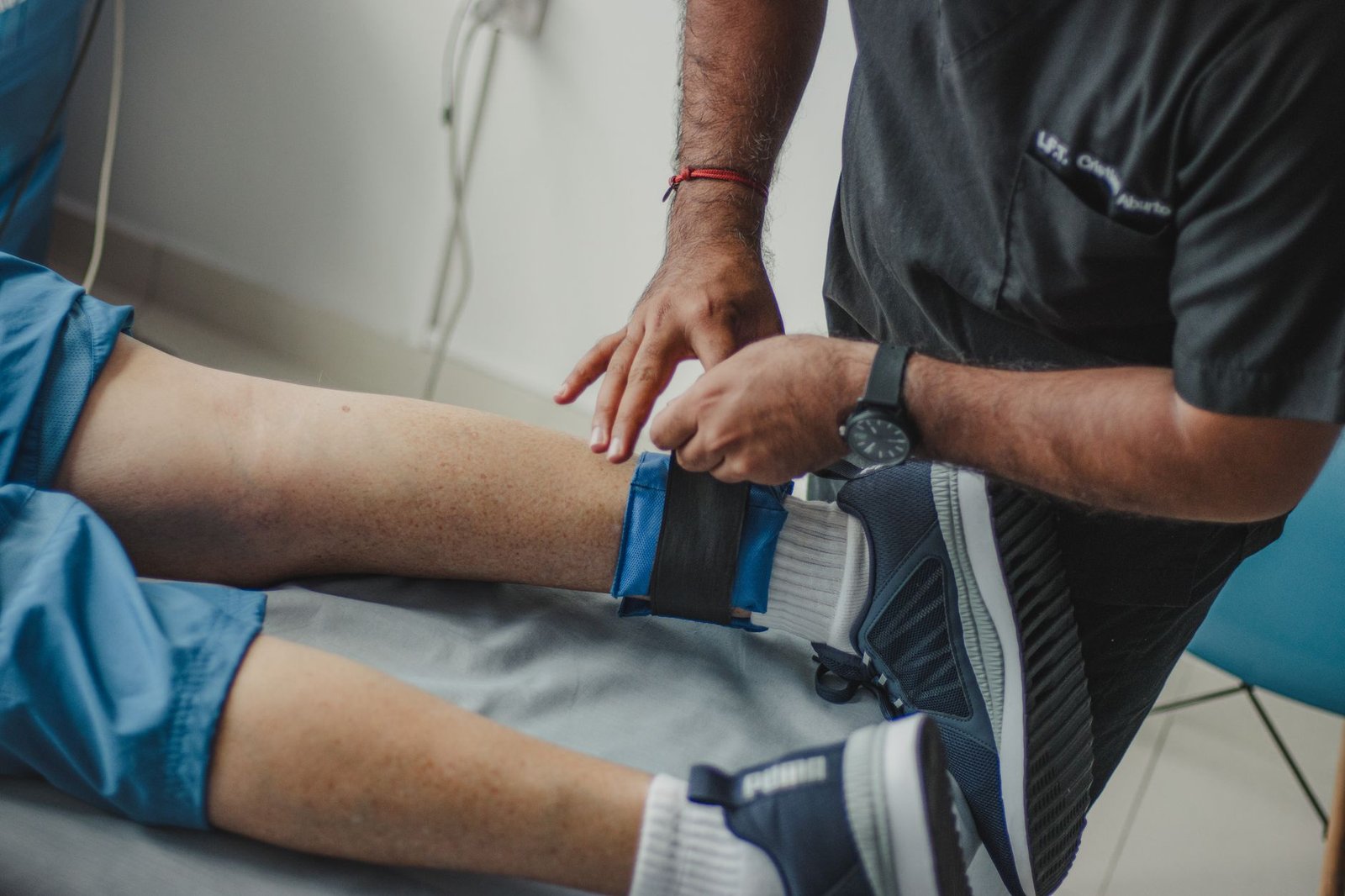 A supportive brace worn on a knee.