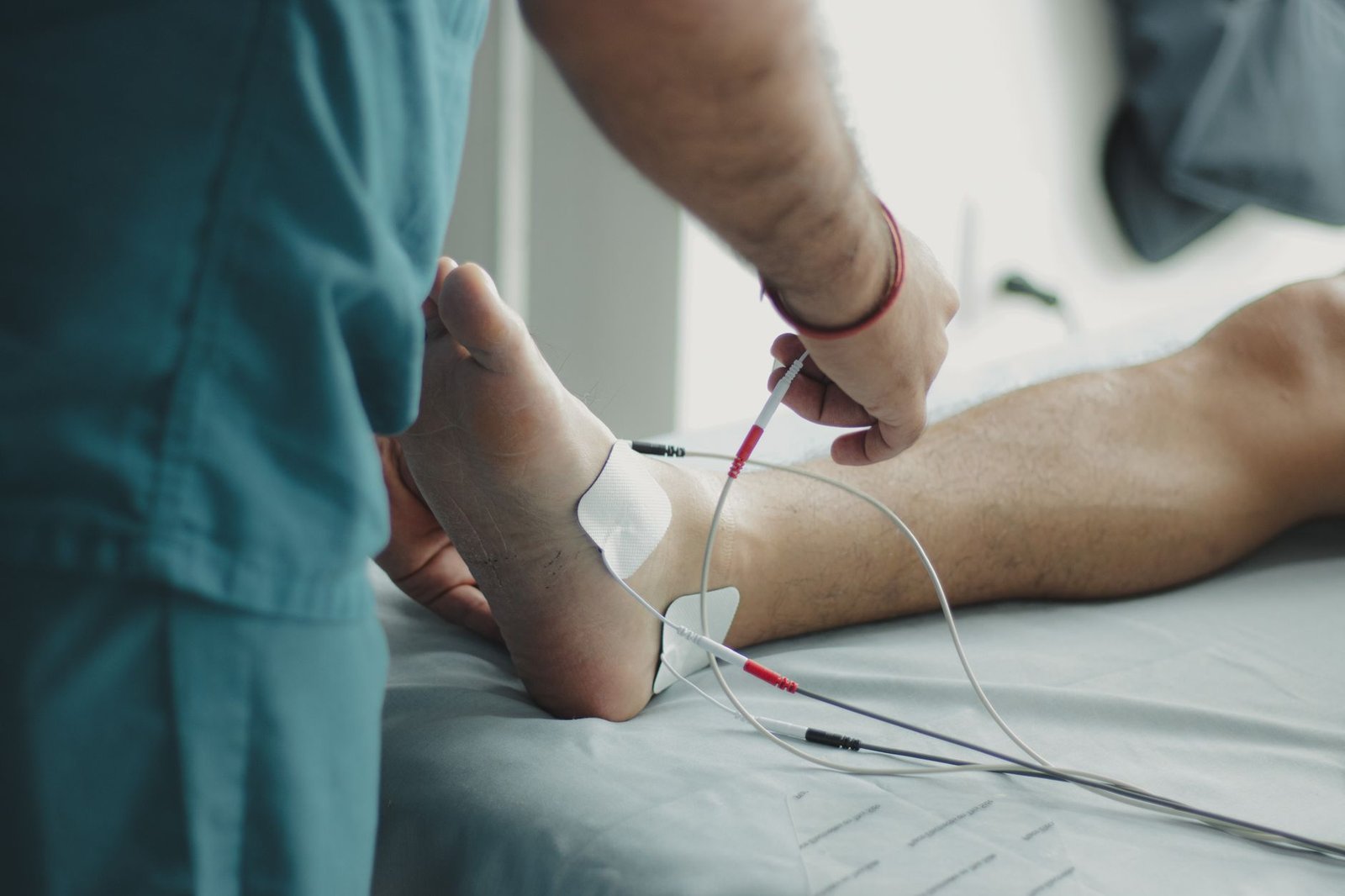 Electrode pads and a small stimulation device on a clean surface.