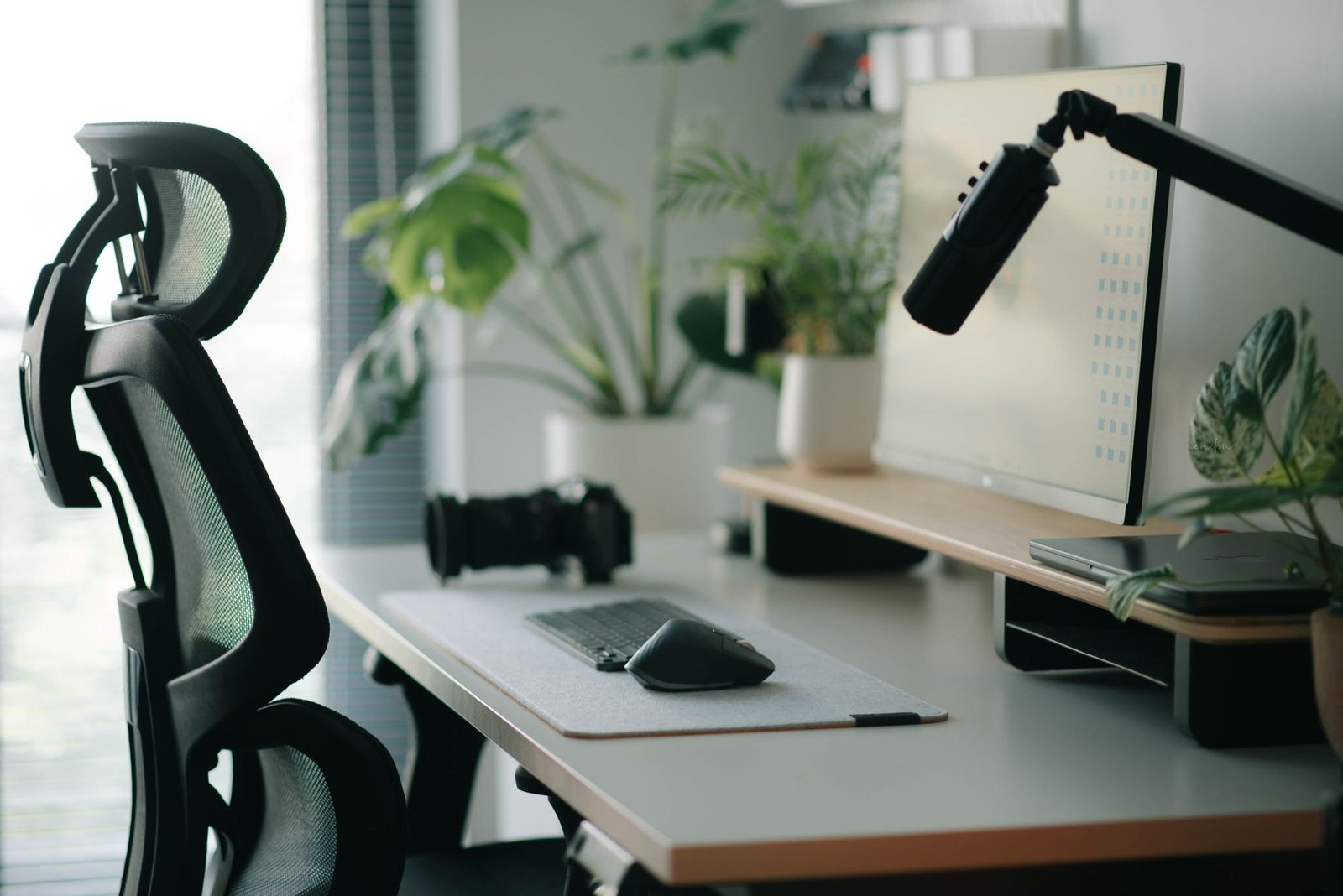 An ergonomic chair and desk set up for seated work.