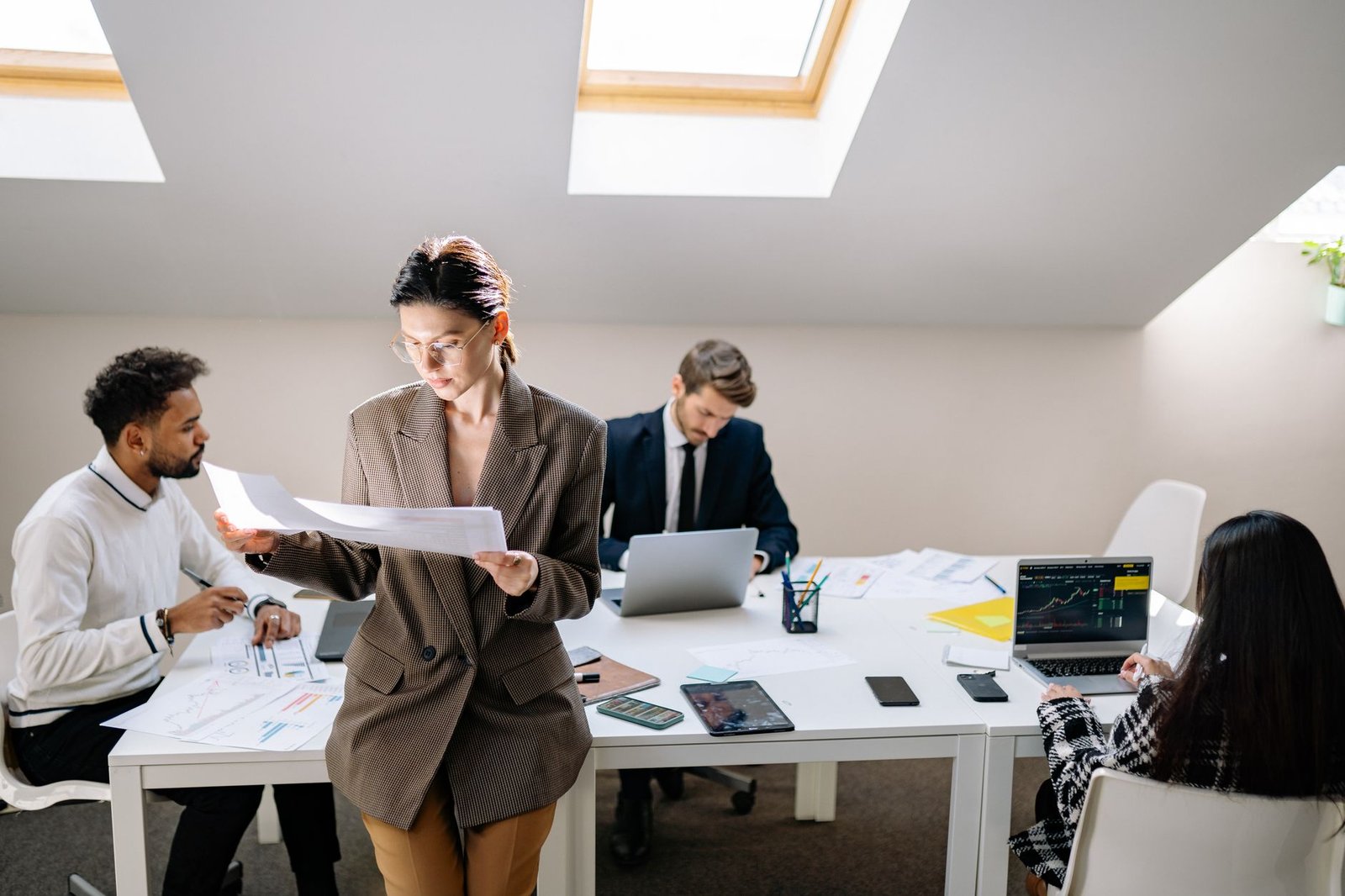 A small team working together in a bright, uncluttered office.